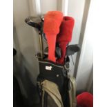 A Mitsubishi golf bag with clubs