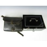 A vintage steel cash box together with an antique leather shoulder pouch