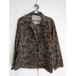 A reproduction Waffen SS camouflaged field tunic