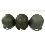 Three US M1 helmets