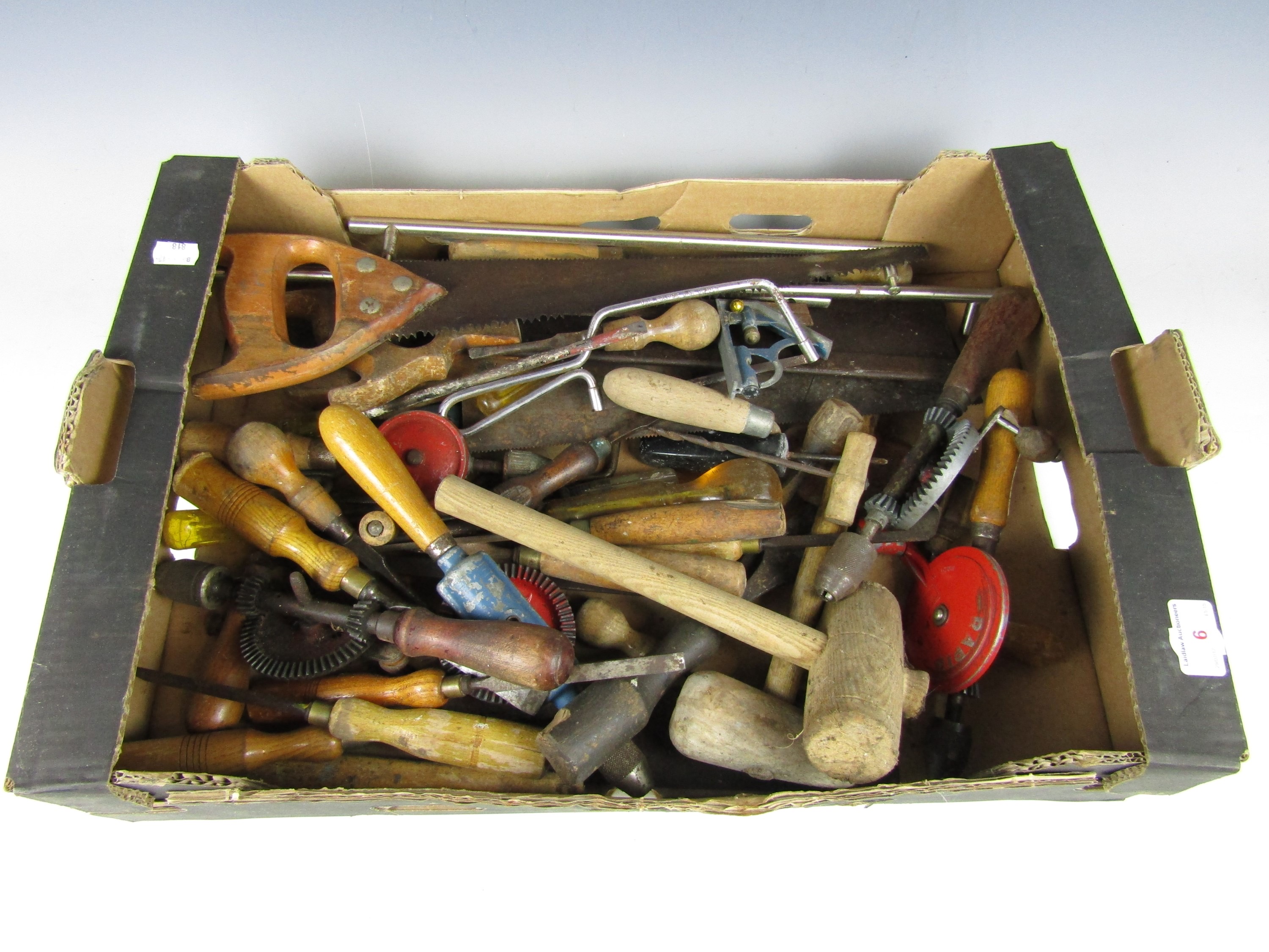 A box of tools including chisels and mallets etc