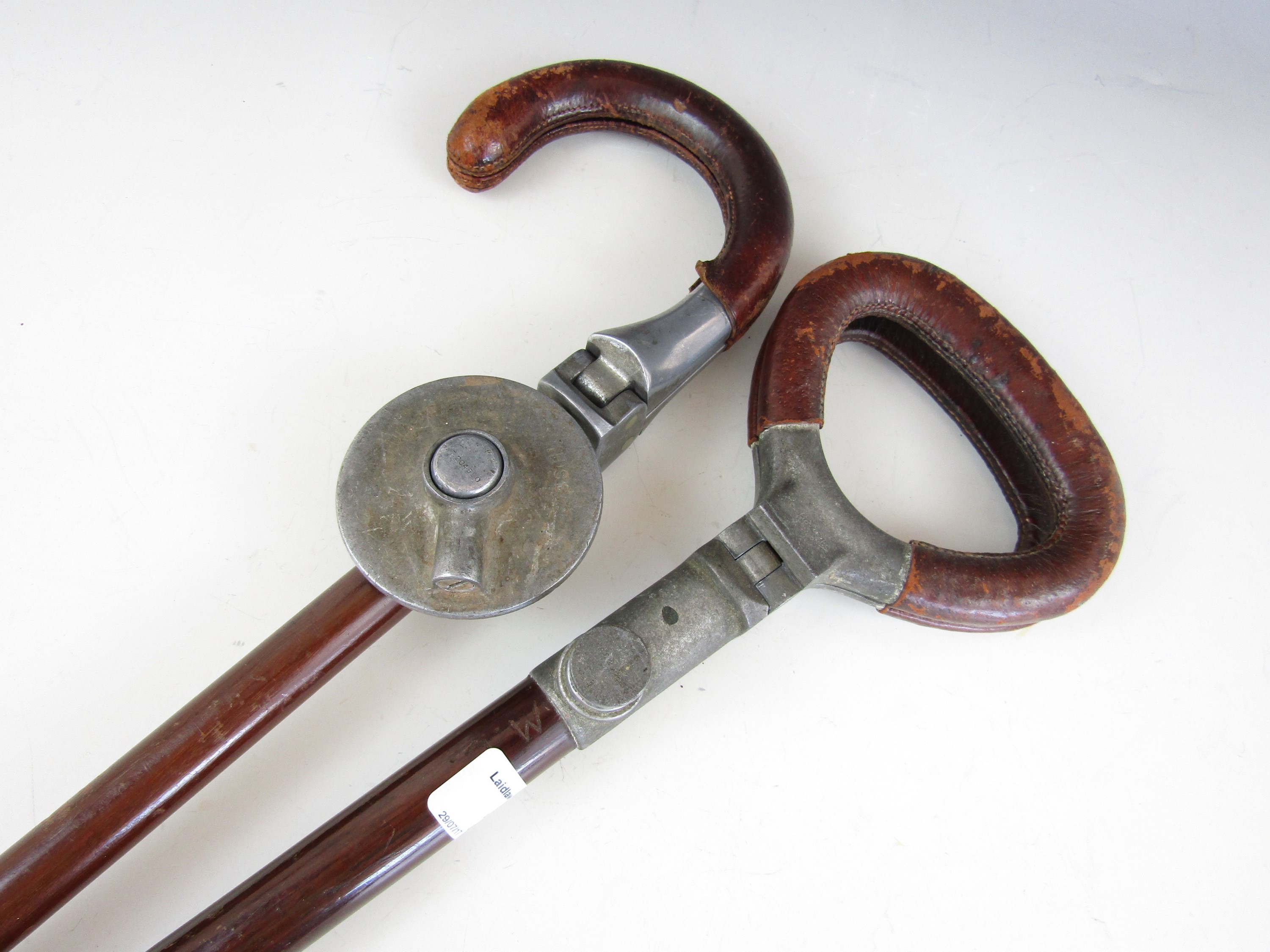 Two vintage shooting sticks