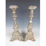 A pair of composite reproduction Baroque candle stands