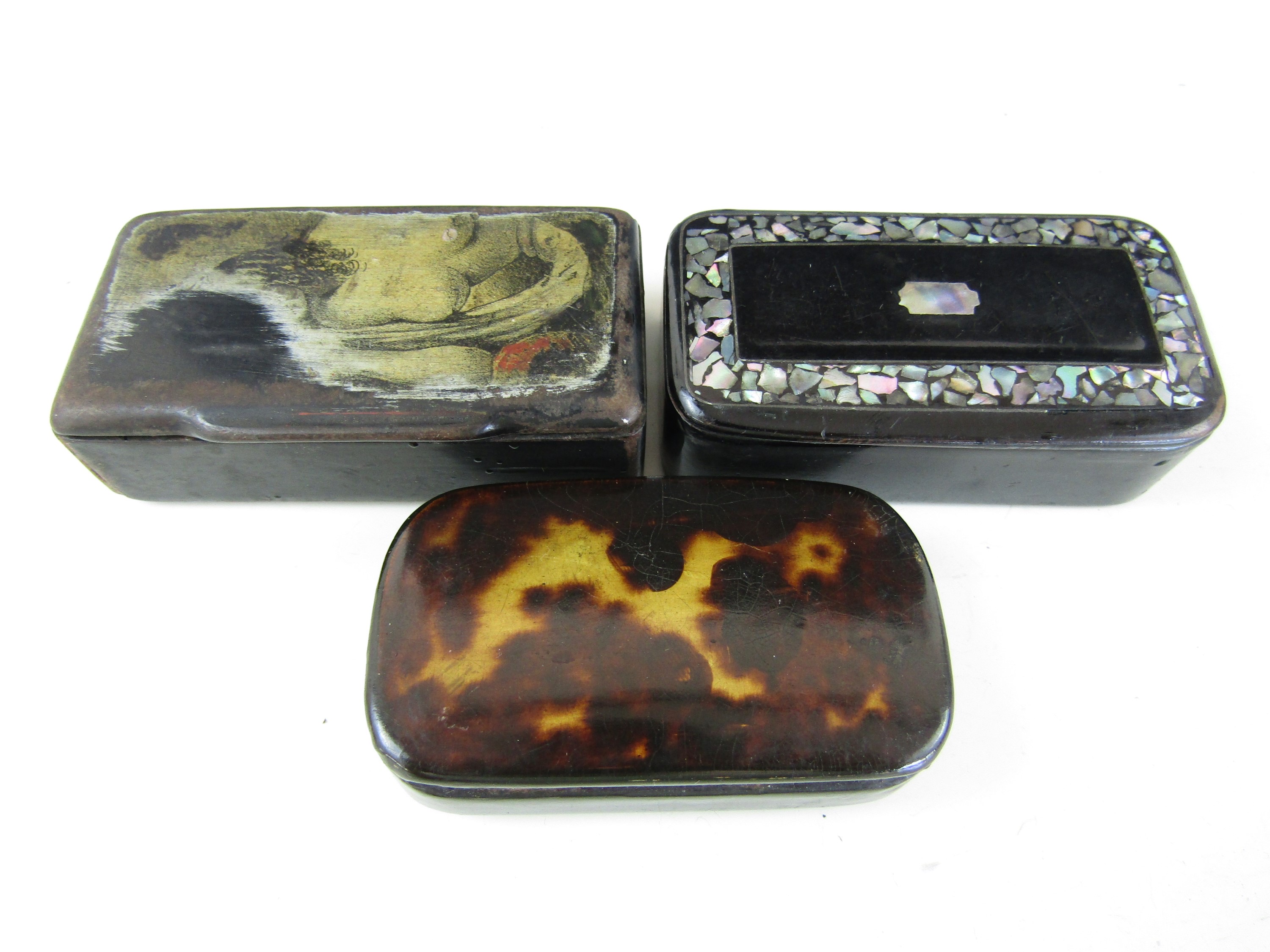 Three 19th century lacquered snuff boxes, one depicting a female nude