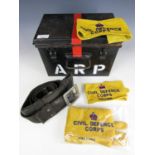 A Second World War ARP first aid tin together with a quantity of Civil Defence Corps brassards and a