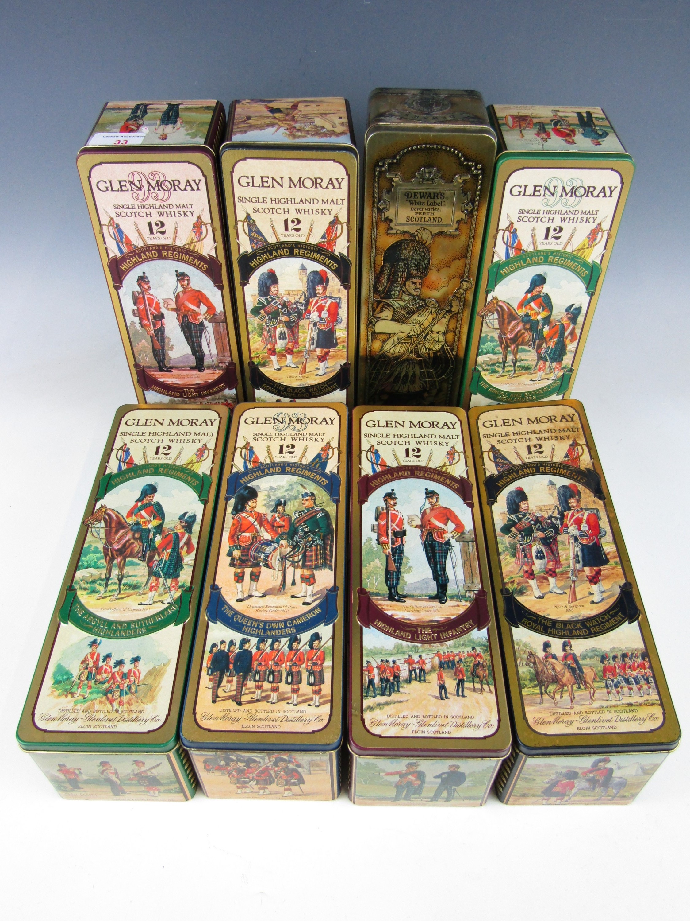 A collection of eight Scottish military themed whisky decanter tins from Glen Moray and Dewars