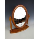 An oval pine framed toilet / dressing mirror