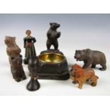 A Black Forest carved ashtray from Engelberg, together with sundry carved bears and a hand made