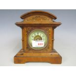 A late 19th century mantel clock with replacement quartz movement