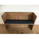 A pine church bench / pew