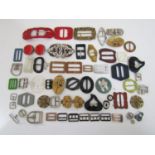 A quantity of early 20th century belt buckles including examples in paste and Lucite etc