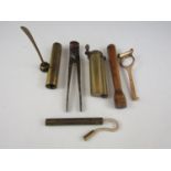 A quantity of vintage firearms related tools including a 12 gauge shotgun cartridge removal tool and