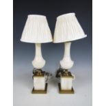 A pair of brass mounted alabaster table lamps