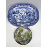 A 19th century blue and white Willow pattern ironstone ashet together with one other plate