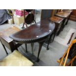 A reproduction mahogany demi-lune hall or side table