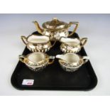 A Gibsons three piece tea set, of Georgian form, decorated with in a floral pattern, together with a