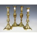 Two pairs of large brass candlesticks