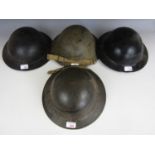 Four 'Tommy' helmets