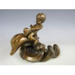 A cherub on dolphin figurine