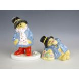 Two 1974 Coalport Paddington Bear figurines including Paddington eats an Apple and Paddington in the