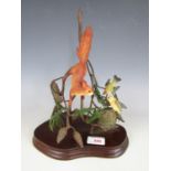 A Border Fine Arts figurine depicting a red squirrel and nesting garden birds