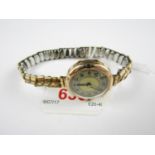 An early 20th Century lady's 9ct gold cased wristlet watch on a rolled gold bracelet strap