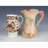 An Arthur Wood jug together with another by E.M and Co (a/f)