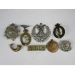 A small quantity of British army badges and a city of Carlisle 1935 jubilee medallion