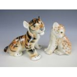 A Lomonosov tiger and cheetah figures