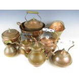 A quantity of sundry copper wares including four kettles, a colander and a small basket etc