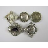 Victorian and later electroplate and base metal brooches, including one centrally set with a