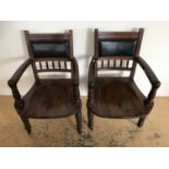 A pair of Victorian upholstered oak armchairs