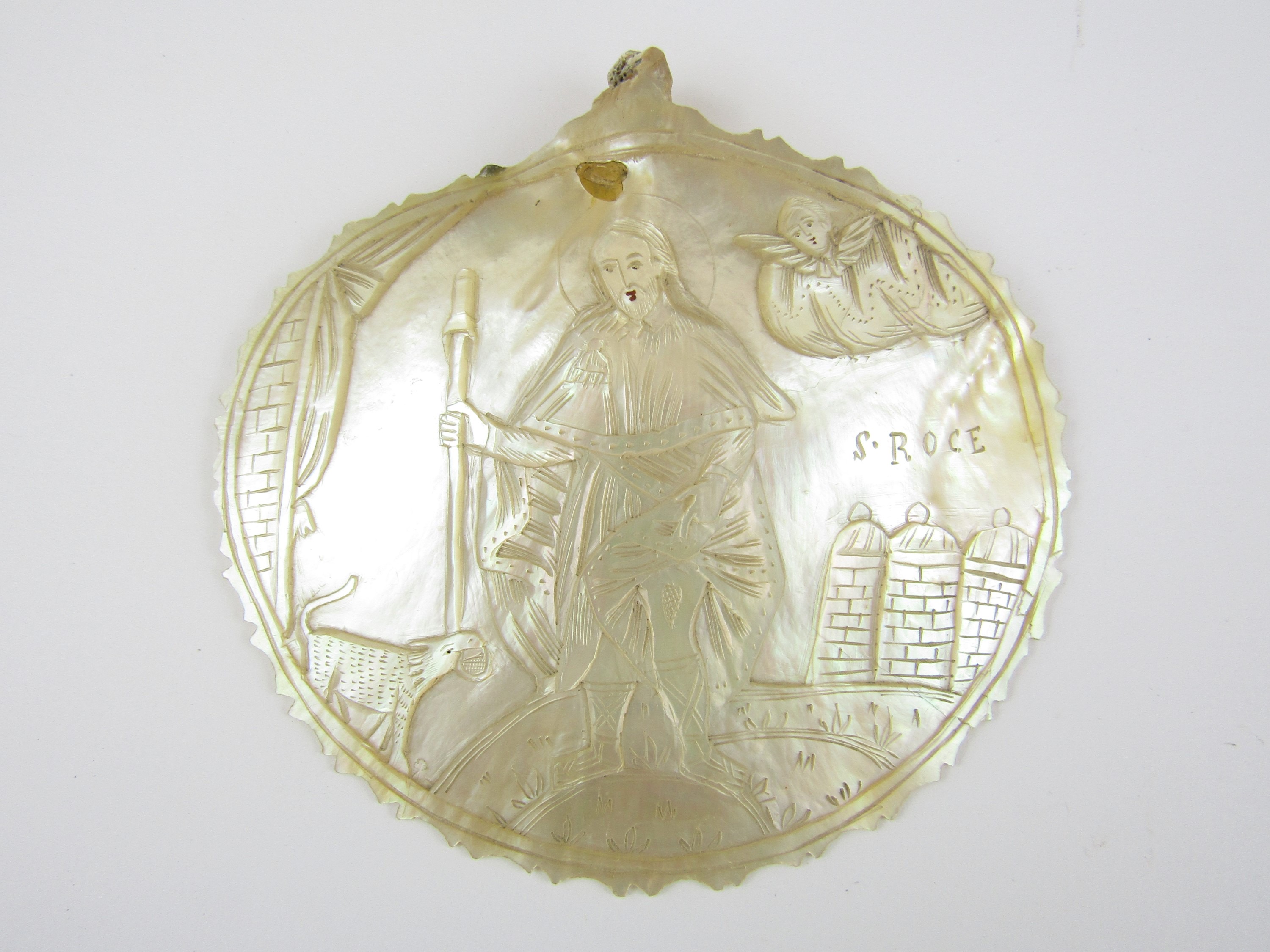 A religious engraved mother of pearl plaque