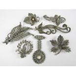 Vintage silver, white metal and marcasite brooches, including one modelled as three feathers,