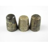 A Henry Griffiths silver thimble together with two other silver thimbles