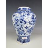 A late 19th / early 20th century Continental blue-and-white stoneware baluster vase