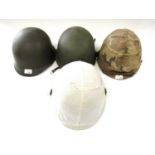 Three US M1 helmets and a shell