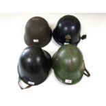 Four post-War European military helmets