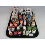 A large quantity of vintage novelty salt and pepper shakers including gnomes, a bride and groom