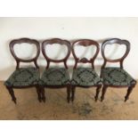 A set of four Victorian balloon-back dining chairs