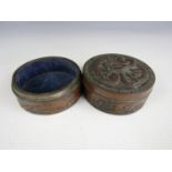 A pair of Chinese bronzed circular boxes, one with slip lid, having moulded decoration in the