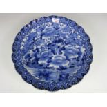 A large Chinese blue and white scallop edged charger