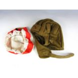 A Soviet AFV crewman's fabric helmet and an East German helmet cover