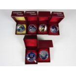 Seven boxed Swarovski small paperweights, some depicting zodiacal signs