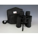 A cased pair of 20 x 50 binoculars
