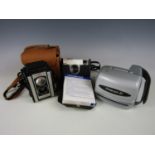 A vintage Polaroid camera together with other cameras