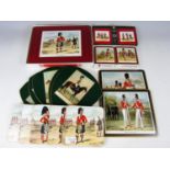 A quantity of place mats and coasters featuring military themes, including Highlanders and