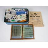 A quantity of cigarette cards and ration books