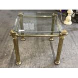 A small gilt and glass lamp table