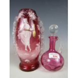 A Mary Gregory style enamelled ruby glass vase together with a small cranberry glass cruet